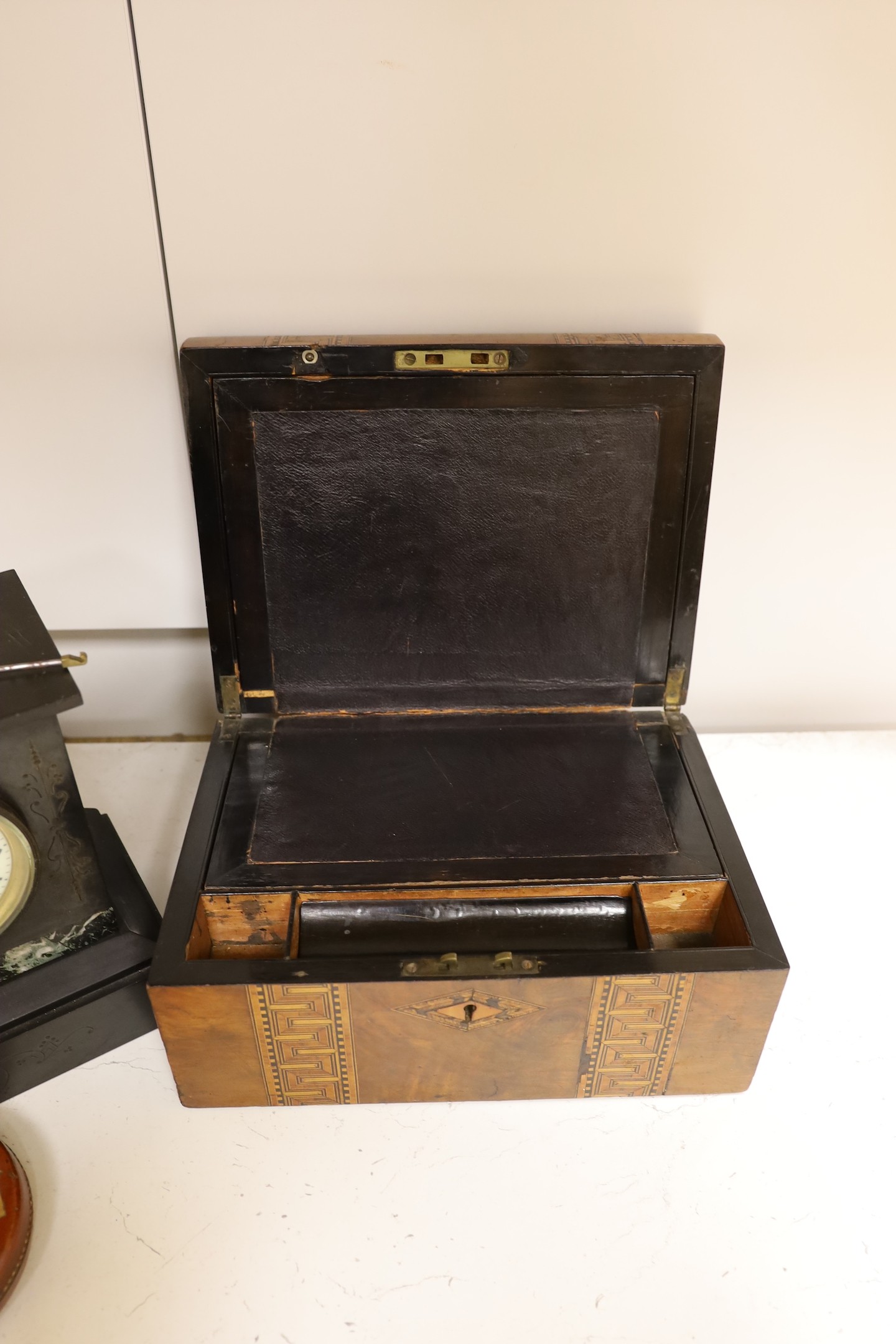 A Victorian black slate mantel clock, a parquetry writing box, a surveyor's measure, a cased French painter's set and various locks and keys